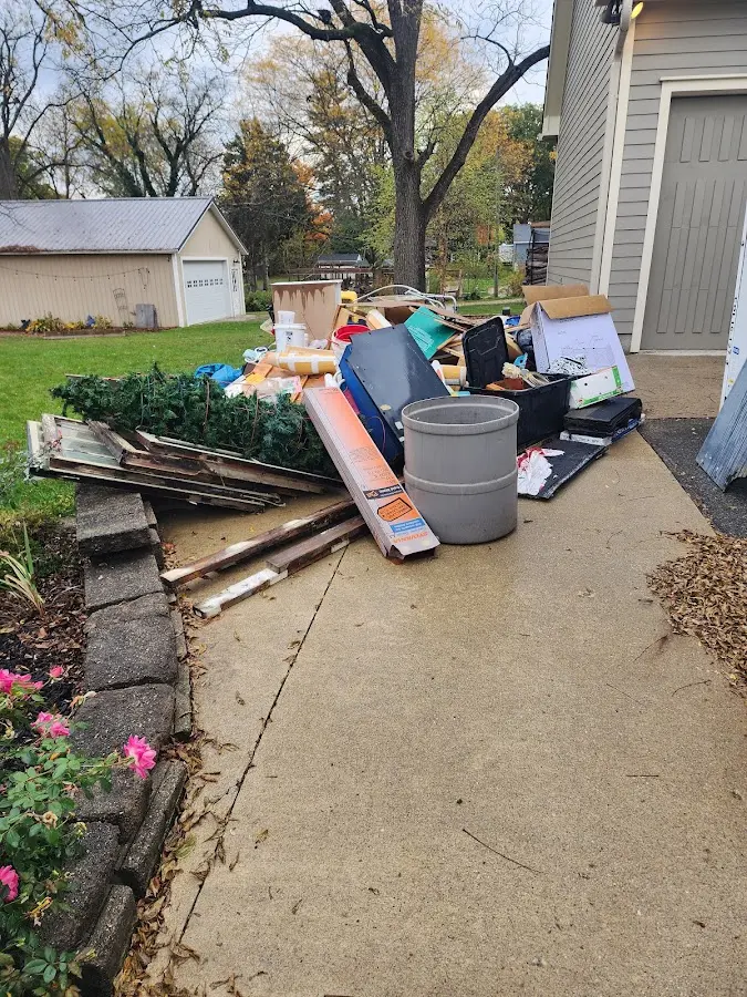 Dumpster being loaded with debris for Roofing Dumpster Rental in Ives Estates
